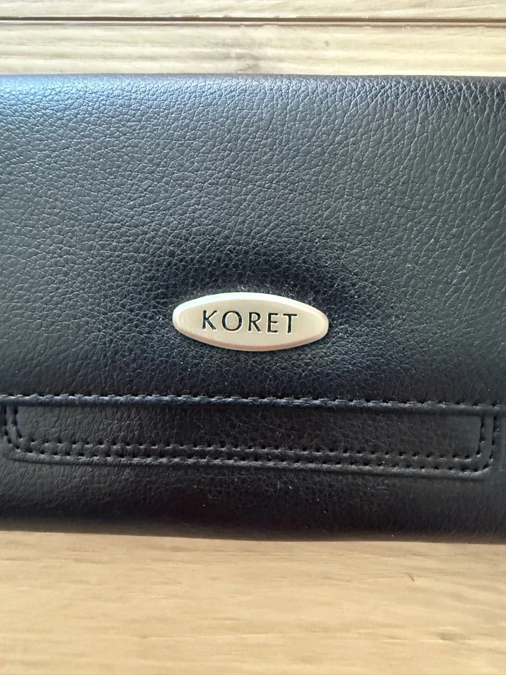 Koret Black Leather Long Flap Wallet with Branded Metal Accent